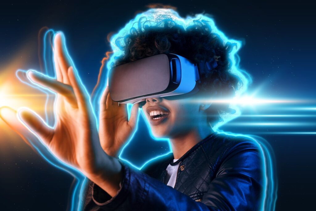 Young Boy Wear the VR Headset Represents The Virtual Reality and Metaverse with Blue Background